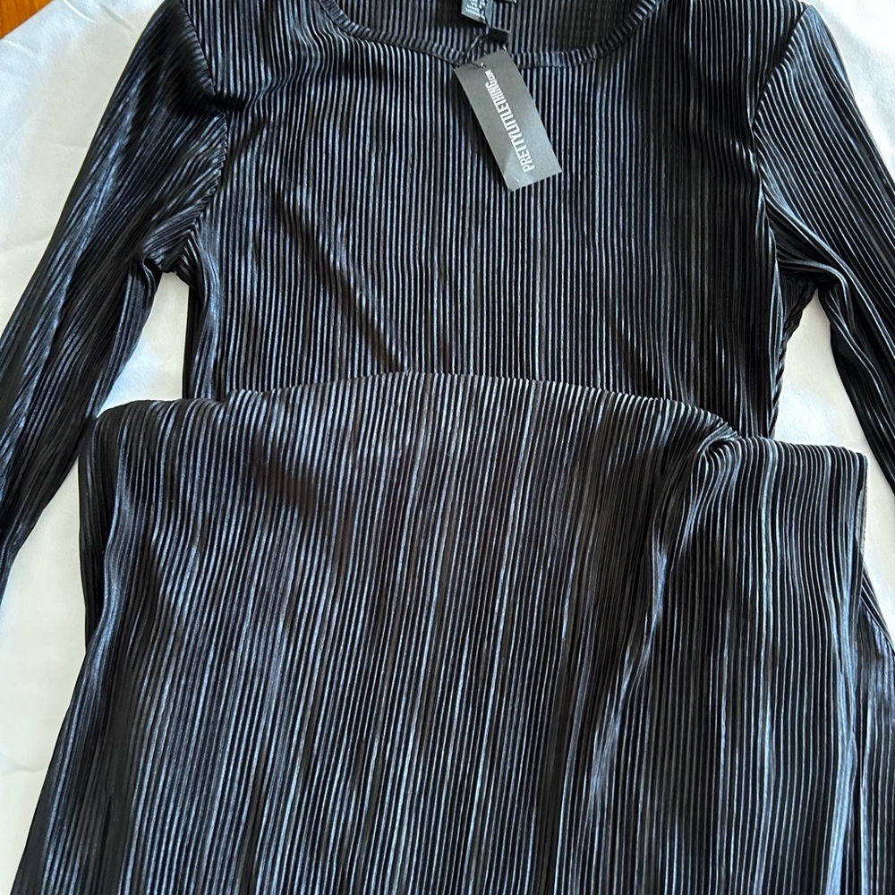 Black Pleated Dress by [Brand]